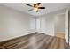 Bedroom with wood-look floors, ceiling fan, closet, and natural light at 10929 Vallerosa St, Las Vegas, NV 89141