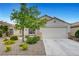 Charming single-story home featuring desert landscaping, a two-car garage, and a cozy, inviting facade at 10929 Vallerosa St, Las Vegas, NV 89141