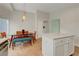 Bright kitchen with a dining area featuring modern pendant lighting and an island at 10929 Vallerosa St, Las Vegas, NV 89141