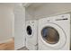 Laundry room featuring a new washer and dryer with storage space at 10929 Vallerosa St, Las Vegas, NV 89141