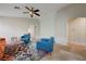 Bright living room featuring neutral walls, a ceiling fan, and tile flooring throughout at 10929 Vallerosa St, Las Vegas, NV 89141