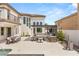 Expansive backyard featuring an outdoor kitchen, dining, and pool at 11453 Glowing Sunset Ln, Las Vegas, NV 89135
