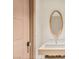 Modern powder room featuring designer wallpaper, floating vanity, vessel sink, and a round mirror at 11453 Glowing Sunset Ln, Las Vegas, NV 89135