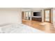 Bedroom features television, built in cabinetry, and doors leading to an outdoor space at 11453 Glowing Sunset Ln, Las Vegas, NV 89135