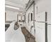 Clean garage features white walls, overhead lighting, and a Tesla powerwall, perfect for EV charging at 11453 Glowing Sunset Ln, Las Vegas, NV 89135