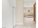 Hallway leading to bath featuring modern vanity and natural light at 11453 Glowing Sunset Ln, Las Vegas, NV 89135