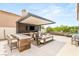 Outdoor kitchen complete with bar seating, grill, tv, and patio at 11453 Glowing Sunset Ln, Las Vegas, NV 89135