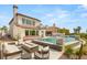 Beautiful outdoor living space with a pool, spa, and fire pit, perfect for entertaining at 11453 Glowing Sunset Ln, Las Vegas, NV 89135