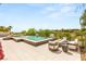 Inviting backyard pool and spa with modern lounge area, perfect for relaxing and enjoying the view at 11453 Glowing Sunset Ln, Las Vegas, NV 89135