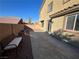 Relaxing backyard featuring a fire pit, bench and concrete patio at 117 Logan Pond Way, North Las Vegas, NV 89084