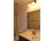 Bathroom featuring a vanity with sink, toilet, shower curtain and lighting at 117 Logan Pond Way, North Las Vegas, NV 89084
