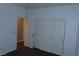 Bedroom with neutral paint and a closet, showing a blank slate for new owners at 117 Logan Pond Way, North Las Vegas, NV 89084