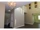 Bright entryway showcasing staircase, high ceilings, statement chandelier and stylish decor at 117 Logan Pond Way, North Las Vegas, NV 89084