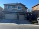 Charming two-story home featuring a two-car garage and well-maintained front yard at 117 Logan Pond Way, North Las Vegas, NV 89084