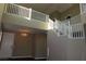 Staircase next to soaring ceilings and artwork creates a dramatic focal point at 117 Logan Pond Way, North Las Vegas, NV 89084