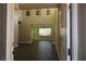 Grand two-story foyer welcomes you with sleek floors, modern lighting, and a view into the living area at 117 Logan Pond Way, North Las Vegas, NV 89084