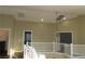 Second-floor landing with view into rooms below at 117 Logan Pond Way, North Las Vegas, NV 89084