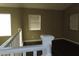 Spacious upstairs landing area with neutral paint, wood-look floors, and natural light from multiple windows at 117 Logan Pond Way, North Las Vegas, NV 89084