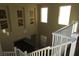Second floor landing featuring high ceilings, natural light, and art niches adorning the walls at 117 Logan Pond Way, North Las Vegas, NV 89084