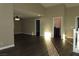 Open-concept living room with lots of natural light and wood-look floors at 117 Logan Pond Way, North Las Vegas, NV 89084