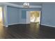 Bright living room with hardwood floors and chandelier at 117 Logan Pond Way, North Las Vegas, NV 89084