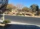 Community park with sand volleyball court, trees and sidewalk at 117 Logan Pond Way, North Las Vegas, NV 89084