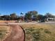 Community playground showcasing several structures, benches and picnic tables for residents at 117 Logan Pond Way, North Las Vegas, NV 89084
