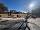 Outdoor playground with climbing structures, swings and shaded seating areas nearby at 117 Logan Pond Way, North Las Vegas, NV 89084