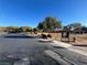 Community playground featuring play structure and manicured bushes at 117 Logan Pond Way, North Las Vegas, NV 89084