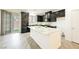 Modern kitchen with black cabinets, stainless steel appliances, and granite countertops at 12426 Mosticone Way, Las Vegas, NV 89141
