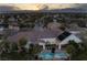 Sunset aerial view showcases this expansive estate with pool, spa, and well-manicured landscaping at 1610 Brock Ct, Las Vegas, NV 89117