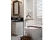 Elegant bathroom showcasing a soaking tub, vanity with stone countertop, and stylish fixtures at 1610 Brock Ct, Las Vegas, NV 89117