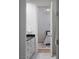 Bathroom featuring white vanity cabinets and a doorway view of the bedroom at 1610 Brock Ct, Las Vegas, NV 89117