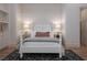 Well-lit bedroom showcases a bed, shiplap accent wall, and built-in shelving at 1610 Brock Ct, Las Vegas, NV 89117