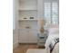 Bedroom with custom shelving and a well-lit window at 1610 Brock Ct, Las Vegas, NV 89117