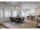 Dining area with wood floors, large windows, modern lighting, and a view into the kitchen at 1610 Brock Ct, Las Vegas, NV 89117