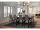 The formal dining room includes large windows and seating for eight at 1610 Brock Ct, Las Vegas, NV 89117