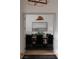 Formal dining room with tray ceilings, wainscoting, stylish pendant lighting and seating for eight at 1610 Brock Ct, Las Vegas, NV 89117
