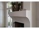 Living room fireplace detail with decor and a view to the outside at 1610 Brock Ct, Las Vegas, NV 89117