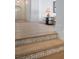 Elegant hallway with hardwood floors, decorative steps, and bright lighting at 1610 Brock Ct, Las Vegas, NV 89117