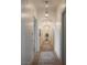 Hallway featuring recessed lighting, arched doorways, and a glimpse of greenery at the end at 1610 Brock Ct, Las Vegas, NV 89117