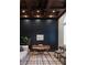 Stylish home office with dark walls, coffered ceiling, and ample natural light at 1610 Brock Ct, Las Vegas, NV 89117