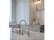 The kitchen boasts marble countertops, farm sink, and stainless steel appliances at 1610 Brock Ct, Las Vegas, NV 89117
