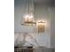 Pendant lighting with marble backsplash, countertops and stainless steel appliances at 1610 Brock Ct, Las Vegas, NV 89117