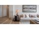 Comfortable living area featuring a modern lamp, soft sofa, and elegant artwork at 1610 Brock Ct, Las Vegas, NV 89117