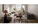 Living room featuring a large window, modern decor, and comfortable seating at 1610 Brock Ct, Las Vegas, NV 89117