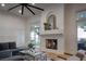 Cozy living room with fireplace and access to the backyard at 1610 Brock Ct, Las Vegas, NV 89117