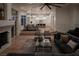 Expansive open-concept living space with hardwood floors that flow into a modern kitchen and dining area at 1610 Brock Ct, Las Vegas, NV 89117