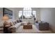 Inviting living room with large window, plush sofas, and stylish accents at 1610 Brock Ct, Las Vegas, NV 89117