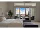 Main bedroom with large sliding glass doors offering views of the pool and mountains at 1610 Brock Ct, Las Vegas, NV 89117
